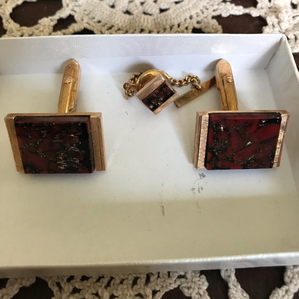 Vintage gold-tone cufflinks and tie pin.